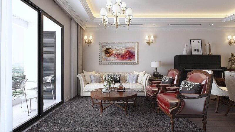 Phòng khách tân cổ điển với gam màu thật vintage của cặp ghế đơn sofa da màu đỏ khung gỗ với đường nét họa tiết hoàng gia mang Thiết kế nội thất phòng khách